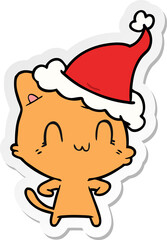 sticker cartoon of a happy cat wearing santa hat