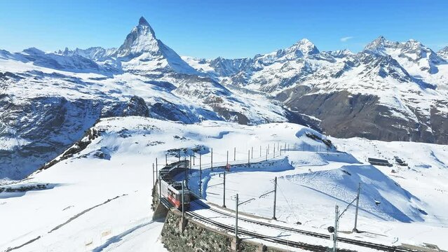 Zermatt, Switzerland -The train of Gonergratbahn running to the Gornergrat station and observatory in the famous touristic place with clear view to Matterhorn.
