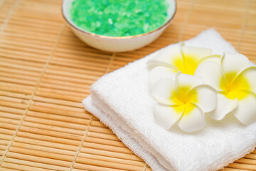 Obraz na płótnie Canvas Spa. Wellness center, Spa treatment concept. Composition with sea salt and lotus flowers on towel.