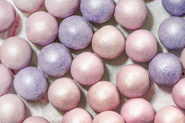 Blush balls, powder balls background. Decorative cosmetics for beauty.