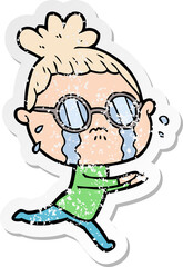 distressed sticker of a cartoon crying woman wearing spectacles