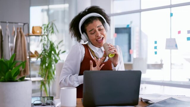 Fashion designer, headphones and woman singing in startup office for creative inspiration, business fun and happy energy. Clothes design worker or black person listening to music in work life balance