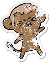distressed sticker of a cartoon annoyed monkey