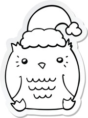 sticker of a cute cartoon owl wearing christmas hat