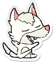 distressed sticker of a cartoon wolf laughing