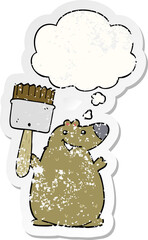cartoon bear with paint brush and thought bubble as a distressed worn sticker