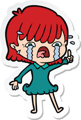 sticker of a cartoon girl crying