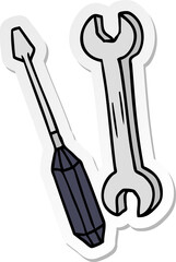 sticker cartoon doodle of a spanner and a screwdriver