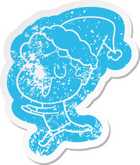 laughing cartoon distressed sticker of a man running wearing santa hat