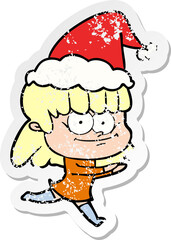 distressed sticker cartoon of a smiling woman wearing santa hat