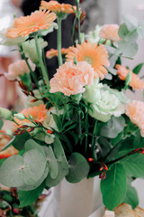 bunch of carnations flowers and eucaliptus