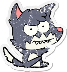 distressed sticker of a cartoon grinning fox