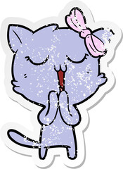 distressed sticker of a cartoon cat