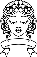 black linework tattoo with banner of female face with eyes closed