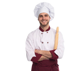 Portrait of positive toothy chef cook in beret, white outfit having tools in crossed arms looking at camera isolated