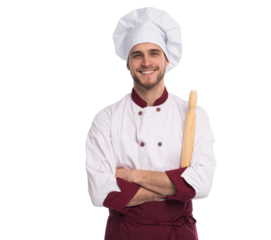 Portrait of positive toothy chef cook in beret, white outfit having tools in crossed arms looking at camera isolated