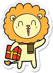 sticker of a laughing lion cartoon with christmas present