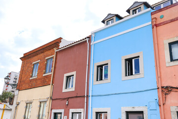 Fototapeta na wymiar Typical Portuguese facades with white windows