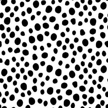 Seamless neutral polka dots pattern. Black hand-drawn circles isolated on white background. Abstract Random points ornament. Vector illustration for wallpaper, fabric, print, wrapping paper, textile