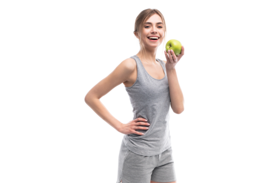 Female fitness model holding apple. Healthy eat and sport concept
