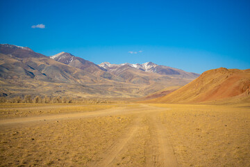 Plakat Road in Kyzyl-Chin valley or Mars valley with mountain background in Altai, Siberia, Russia.