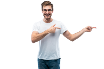 Portrait of a joyful young man pointing fingers away at copy space on his palm isolated over transparent background