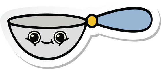 sticker of a cute cartoon measuring spoon