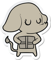 sticker of a cute cartoon elephant with gift