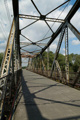 Obraz premium Old metal bridge across Dniester river in the city of Halych, western Ukraine