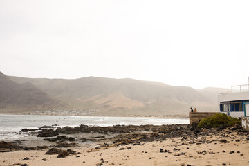 couple sitting looking at the sea