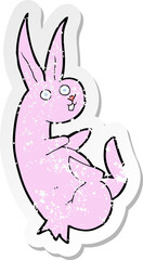 retro distressed sticker of a cue cartoon rabbit