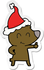 female bear sticker cartoon of a wearing santa hat