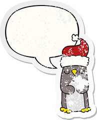 cartoon christmas penguin and speech bubble distressed sticker