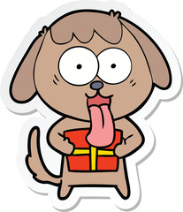 sticker of a cute cartoon dog with christmas present