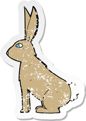 retro distressed sticker of a cartoon rabbit