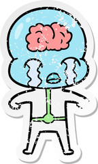 distressed sticker of a cartoon big brain alien crying