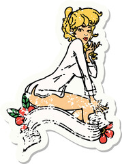 distressed sticker tattoo of a pinup girl wearing a shirt with banner