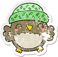 distressed sticker of a cute cartoon owl in hat