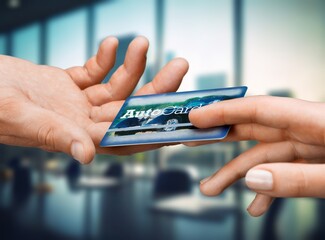 Human hands giving bank card