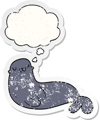 cute cartoon seal and thought bubble as a distressed worn sticker