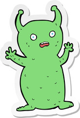 sticker of a cartoon funny little alien