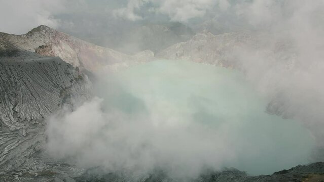 Stunning aerial view of Ijen Volcano with turquoise acid lake. East Java, Indonesia.