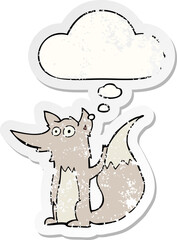 cartoon wolf and thought bubble as a distressed worn sticker