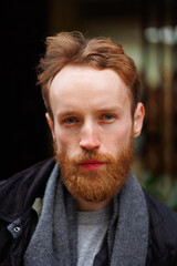 Close-up portrait of a bearded man outdoors