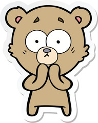sticker of a worried bear cartoon