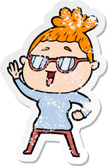 distressed sticker of a cartoon happy woman wearing spectacles