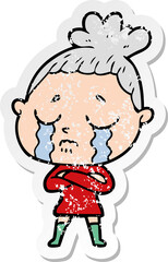 distressed sticker of a cartoon crying woman