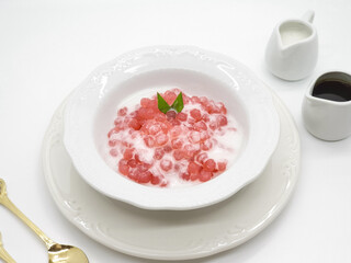 Bubur Sagu Mutiara, Indonesian Dessert Porridge. Made from pearl sago (sagu mutiara), sugar, pandan leaves, and coconut milk. Space for text