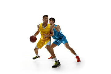 Fototapeta na wymiar Sports passion. Two male athletes, basketball players in action, motion compete during the game, match.
