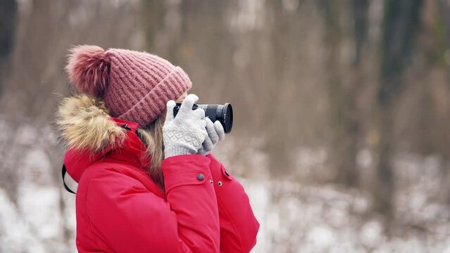 girl photographs natural scenery with her camera